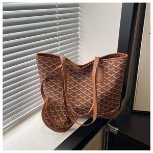 Detail of the tote bag with classic Y-pattern canvas and a matching small detachable pouch