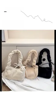Close-up of plush shoulder bags in cream, beige, and black with ruffled bow handles