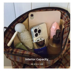 Detailed internal view showing large capacity for tablet, umbrella and cosmetics