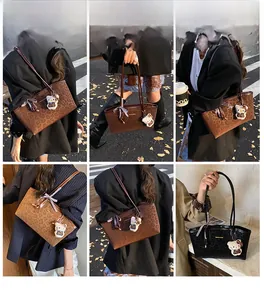 Dettaglio della grande borsa tote leopardata con finitura lucida e fiocco decorativo