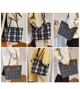 Detail view of large checkered wool tote bag with leather straps in multiple colors
