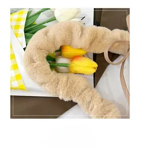 Close-up of soft beige faux fur handle cover on a trendy plush shoulder handbag