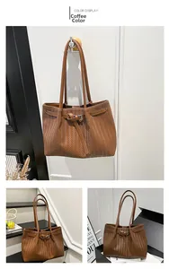Detail of coffee tote bag featuring herringbone weave texture and slender shoulder straps