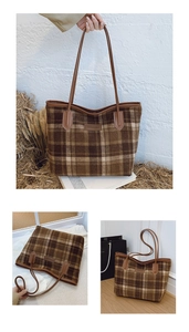 Detail of a brown plaid tote bag with leather handles and autumn decor elements