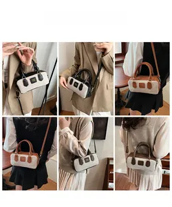 Detail view of retro mini bowling bag shown in handheld and shoulder carry styles
