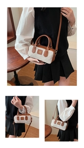 Detail of vintage canvas handbag with brown leather trim and COIN '2DN logo hardware