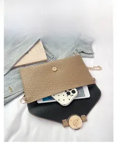 Interior view showing khaki woven envelope bag capacity for smartphone and tablet
