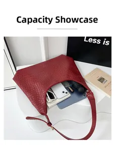 Interior view showing the large capacity and woven texture of the red hobo tote bag