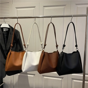 Minimalist large tote bag collection in four colors with decorative knotted straps