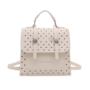 Chic cream polka dot mini backpack with Tidal Dryness print and adjustable straps