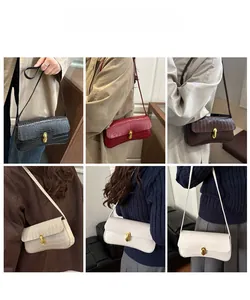 Detailed views of faux crocodile leather baguette bags in various colors on models