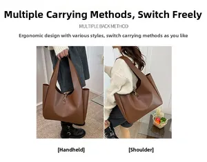 Detail of caramel pebbled leather tote bag with elegant gold metal hook closure