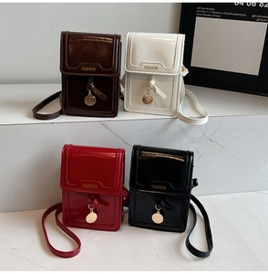 Detail showing colorful glossy faux leather phone bags with Fashion embossing and metal charms