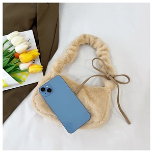 Mini plush beige shoulder bag with ruffled handle and phone for size comparison