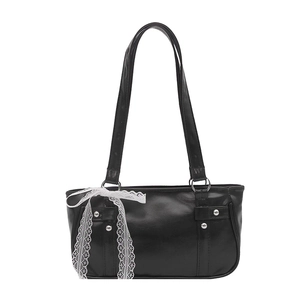 Minimalist black faux leather shoulder bag with white lace bow and silver stud details