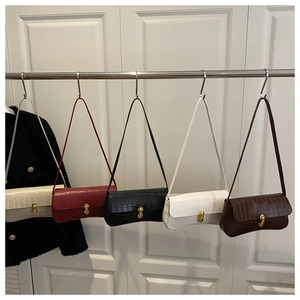 Five crocodile pattern baguette shoulder bags in beige, red, black, white, and brown colors