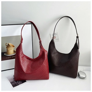 Close-up of woven texture and adjustable metal buckle on tote bags in burgundy and coffee