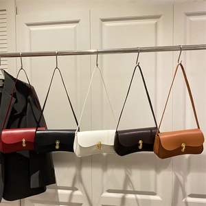 Minimalist vintage underarm bags in red, black, white, and brown with gold buckles