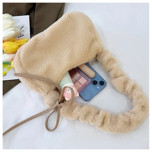 Interior view showing the large capacity of a beige plush faux fur shoulder bag