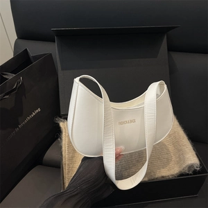 Minimalist white crescent shoulder bag in matte faux leather with premium gift box packaging