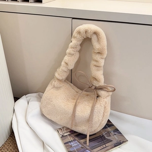 Beige plush shoulder bag with gathered handle and decorative side ribbon bow