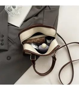 Internal view of the large capacity retro Boston bag with daily essentials inside