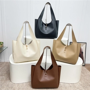 Minimalist leather tote bag with horseshoe buckle in four elegant colors on display