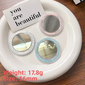 Macro detail of 56mm mini round makeup mirrors weighing 17.8g with Gift For You text