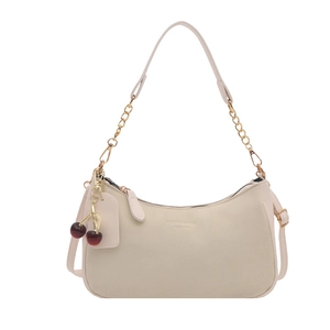 Chic cream half-moon shoulder bag with gold chain strap and cherry charm detail