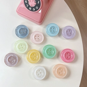 Macro shot of colorful glitter resin button phone grips in pastel macaron shades