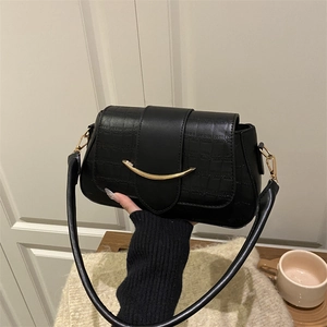 Chic black crocodile texture underarm bag with elegant gold curved buckle detail
