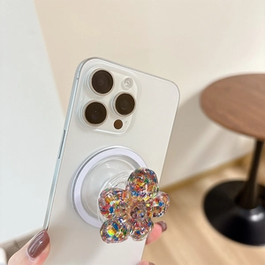 Close-up of sakura flower MagSafe grip with colorful glitter and transparent base