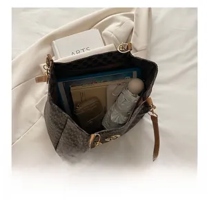 Detailed interior of the brown monogram tote bag showing large storage capacity