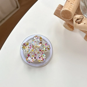 Detailed view of flower phone socket with colorful glitter and sequins inside