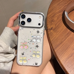 Detail of glittery cherry iPhone case with 3D stars and silver camera lens protection