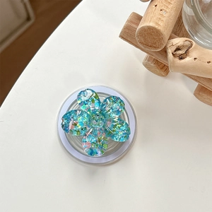 Macro detail of blue glitter cherry blossom flower phone grip with Magsafe suction