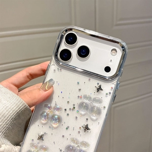 Close-up of clear iPhone case with 3D flowers, silver stars, and glitter accents