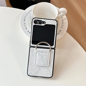 Detail of white crocodile texture phone case with silver ring holder for foldable devices