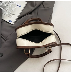 Top view of retro contrast pillow bag showing interior compartment and metal zipper