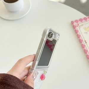 Detail view of transparent Z Flip case featuring 3D red cherries and heart patterns