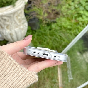 Close-up of precise charging port and speaker cutouts on the clear iPhone case