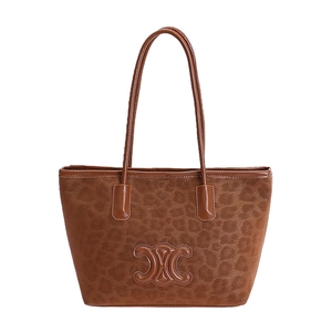 Brown leopard pattern tote bag with embossed logo and leather straps on white background