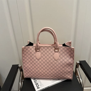 Pink monogram tote bag with repeating M pattern and leather handles for women