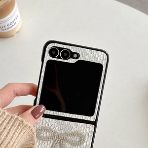 Close-up of white leather texture phone case with rhinestone butterfly for Z Flip