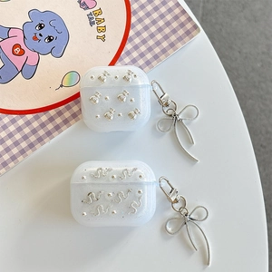 Sparkly light blue AirPods case with silver charms and bow pendant in Korean style