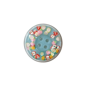 Glittery magnetic phone grip with colorful fruit slices and sparkling blue gel