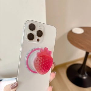 3D strawberry magnetic expanding phone grip and stand on white smartphone back