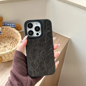 Close-up of black leather texture phone case with marble pattern for iPhone series