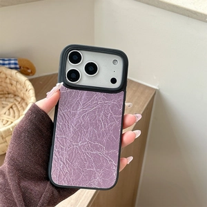 Macro shot of lavender purple pleated leather phone case with black anti-collision borders