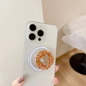 Round glitter phone socket with heart mirror and mine text on white smartphone